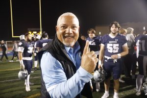 After clinching a playoff berth and a National Northern League title, Warriors defensive coordinator Matt Kirk holds up one finger to signify his team as league champions. Kirk and the Warriors will wrap up the regular season on the road against Allan Hancock on Nov. 16. (Greg Fontanilla | The Union)