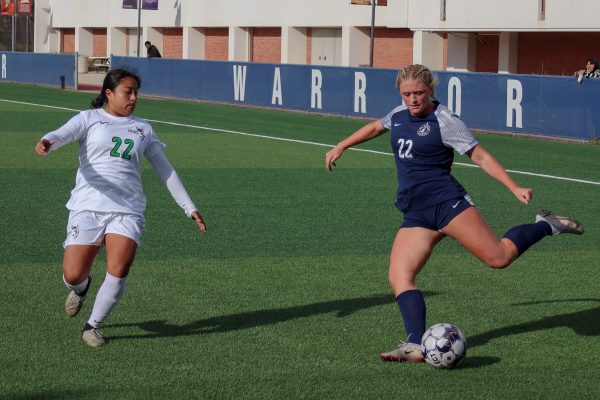 El Camino College Warriors defender Frankie McKinnon, right, kicks the ball towards the East Los Angeles College Huskies’ goal as Huskies defender Veronica Diaz Chino tries to block it during the women’s soccer match on Tuesday, Nov. 5. After leading 1-0 in the first half, the Warriors would win its final game of the regular season against the Huskies 6-0. The Warriors will play against the Cerritos College Falcons in the first round of the South Coast Conference Tournament on Friday, Nov. 8. (Eddy Cermeno | The Union)