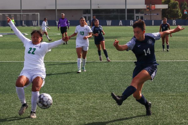 El Camino College Warriors forward Claire Mahon, right, kicks the ball past East Los Angeles College Huskies defender Veronica Diaz Chino in the penalty area during the women’s soccer match on Tuesday, Nov. 5. After leading 1-0 in the first half, the Warriors would win its final game of the regular season against the Huskies 6-0. The Warriors will play against the Cerritos College Falcons in the first round of the South Coast Conference Tournament on Friday, Nov. 8. (Eddy Cermeno | The Union)