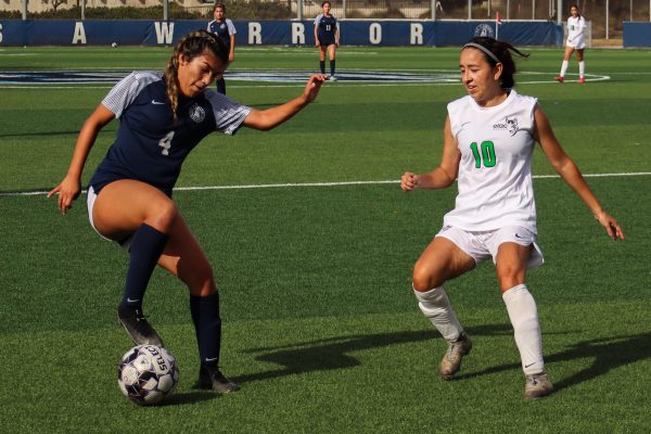 El Camino College Warriors midfielder Ruby Colcol, left, dribbles the ball in the penalty area around East Los Angeles College Huskies defender Isabel Lopez during the women’s soccer match on Tuesday, Nov. 5. Colcol scored her fifth goal of the season in the second half of the game to make the score 4-0. After leading 1-0 in the first half, the Warriors would win its final game of the regular season against the Huskies 6-0. The Warriors will play against the Cerritos College Falcons in the first round of the South Coast Conference Tournament on Friday, Nov. 8. (Eddy Cermeno | The Union)