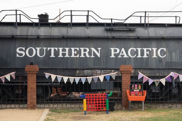 ide view of the #1765 Southern Pacific tender car at the Lomita Railroad museum with Children's Day Activities in front. Children's Day was held on Sept. 21 2024 on the lawn next to the museum. The event featured booths, performances, and demonstrations from multiple model railroad clubs. (Katie Gronenthal | The Union)