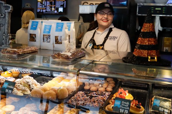 Sales associate Kat Faber, 36 grins behind the counter on Oct. 11. She is one of 117 people employed at Torrance Bakery. “It’s a healthy work environment,” sales associate Kat Faber, 36, said. “Everyone here is really friendly and respects each other.”