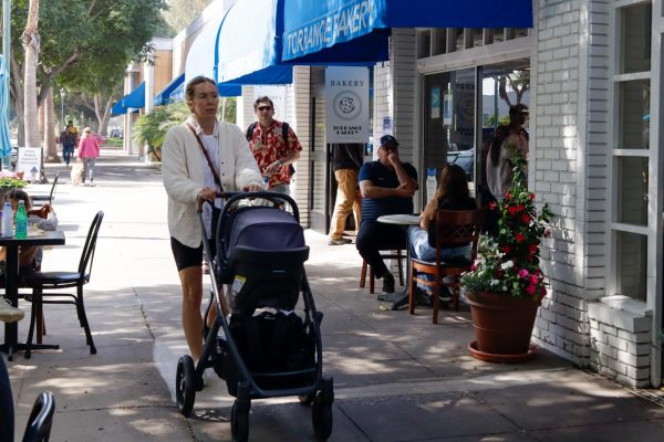 A woman and her infant take a walk along El Prado Avenue in Torrance on Saturday, Oct. 11. The outdoor seating the Torrance Bakery provides is a popular spot for customers to take a seat and enjoy a coffee or cookie.