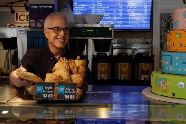 Kirk Rossberg dishes out an apple turnover at Torrance Bakery on Oct. 11. Rossberg is the owner and president of Torrance Bakery, a local institution which has been serving cookies, doughnuts and cakes to the South Bay for 40 years.