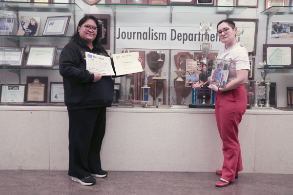 Ma. Gisela Ordenes, left, boasts a second-place award for Reporter of the Year issued by the College Media Assocation, while Erica Lee holds magazines she won awards for. Lee was awarded first-place in Best Profile for the reporting category and second-place in Best Multimedia Feature Story. Ordenes took home several awards that included second-place in Best Editorial and third-place in Best Investigative Story. (Angel Pasillas | The Union)