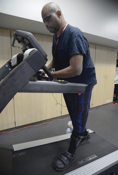 Starlin Jones begins his 15-minute treadmill session inside the Adapted Fitness Room on Nov. 7. Jones is paralyzed on the left side of his body after suffering a stroke and a brain hemorrhage in 2009. (Angel Pasillas | Warrior Life)