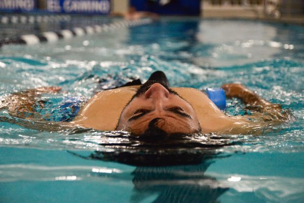 George Zamora floats in the shallow pool at the Adapted Pool on Oct. 15, 2024. The pool is Zamora’s happy place and floating is one of his favorite activities. “It’s very peaceful,” Zamora said. (Angel Pasillas | Warrior Life)