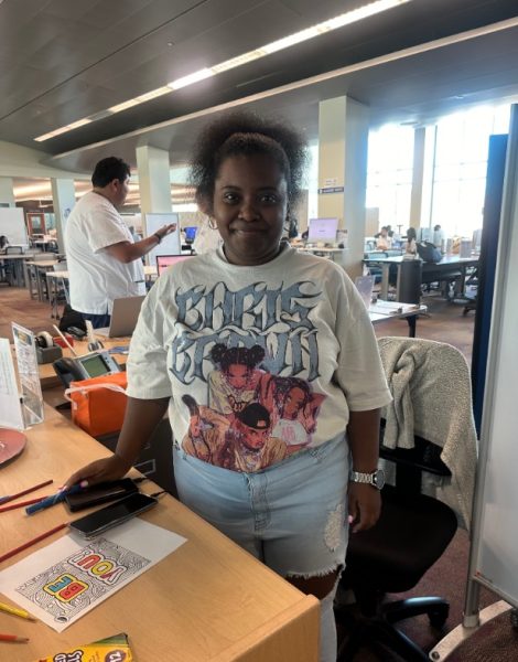 Keyari Frye, 31, a part-time library technician, has been working at El Camino College for 10 years. “I’m trying to make the library into something nice,” she said. “I don’t want it to feel down, I just want to make it fun and exciting, and so far, I think it’s working.” (Isabella Espat | The Union)