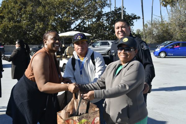 Director of Public Information and Government Relations Kerri Webb and Interim Police Chief Ruebin Lopez keep the event organized while also doing their part to engage with the community. (Rosemarie Turay | The Union)