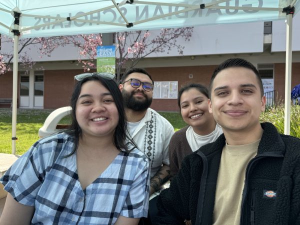 El Camino College Guardian Scholars and Next Step success coaches (from left to right) Rozlind Silva, Jesse Marinero, Lara Colindres and Alberto Navarro Zepeda reach out to students at a resource fair on campus on March 27, 2024 in Torrance, Calif. The two ECC programs serve students impacted by the foster care system, providing coaching to navigate the complex processes of enrollment, registration, financial aid and scholarships, workshops covering everything from budgeting to time management, peer support from other students who have experienced similar challenges and help paying for food and books. (Kim McGill | The Union)