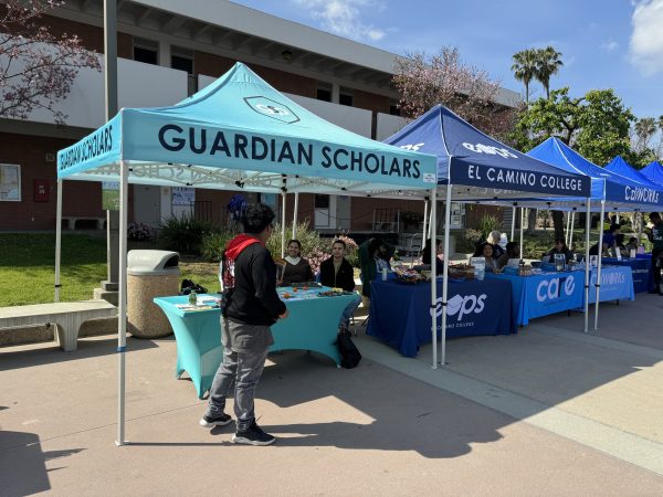 El Camino College Guardian Scholars and Next Step success coaches reach out to students at a resource fair on campus on March 27, 2024 in Torrance, Calif. The ECC programs serve students impacted by the foster care system. (Kim McGill | Warrior Life)