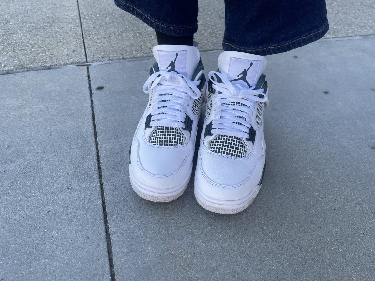 Fashion major Davon Scruggs, 19, wears the Air Jordan 4 "Oxidized Green" near Cafe Camino at El Camino College on Oct. 23. (Jaylen Morgan | Warrior Life) Photo credit: Jaylen Morgan