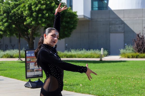 Alahna Alton, 21, dances at campus events to promote El Co Salseros and recruit members. Pictured here at the Library Lawn at El Camino College on Oct. 3, Alton dances her bachata solo during the college's Hispanic Heritage Week celebration. (Angela Osorio | Warrior Life)