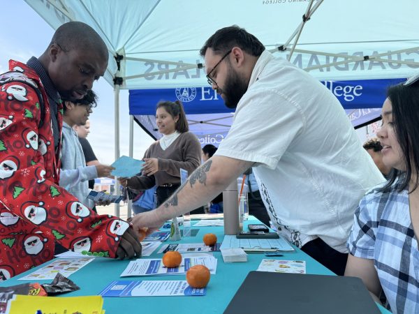 El Camino College Guardian Scholars and Next Next Step success coaches (from left to right) Lara Colindres, Rozlind Silva, Jesse Marinero, and Alberto Navarro Zepeda reach out to students at a resource fair on campus on Wednesday, March 27. The two ECC programs serve students impacted by the foster care system, providing coaching to navigate the complex processes of enrollment, registration, financial aid and scholarships, workshops covering everything from budgeting to time management, peer support from other students who have experienced similar challenges and help paying for food and books. (Kim McGill | Warrior Life)