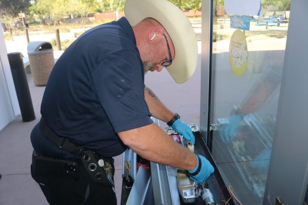 Roy Dietz, 51, works on repairing a door in the Administration Building at El Camino College on Sept. 20. Dietz said he first learned locksmithing from his father-in-law, who would take Dietz to work with him on dorm doors at USC. (Joseph Ramirez | Warrior Life)