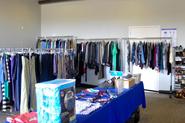 Racks and shelves of shirts, pants, shoes and other clothing and personal items line the walls of The Basic Needs Center's Warrior Wardrobe at El Camino College. (Argentina Talley | The Union)