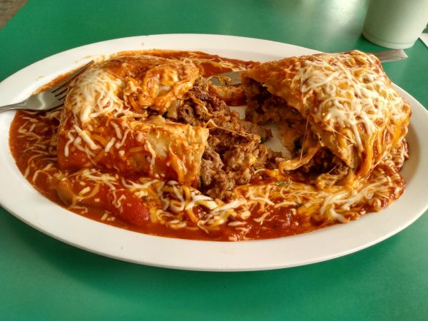 A large cheesy combination burrito served hot from Pancho's on May 4. Filled with asada meat, spicy sauce, and cheese. (Joseph Ramirez | The Union)