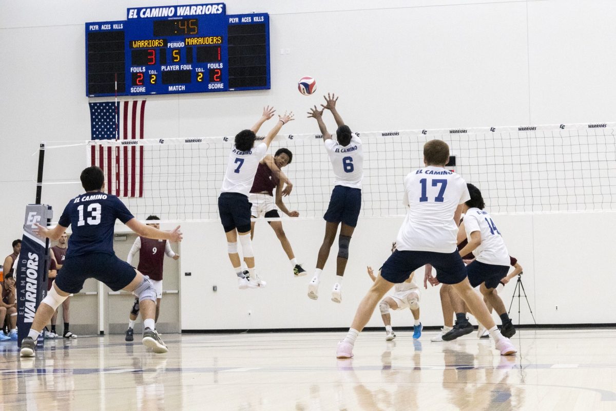 El Camino College Warriors outside hitter Jordan Jotie (center left) and middle blocker Matthew Miller (center right) deflect a spike from the Antelope Valley College Marauders while libero Luke Chambers (left), outside hitter Owen Loebs (right) and outside hitter Timothy Benedict (far right) stand ready during the fifth set at the ECC Gymnasium Wednesday, Feb. 26. Shaking off a four-game losing streak, the Warriors defeated the Marauders 3–2 in a five-set game. (Vincent Lombardo | The Union)