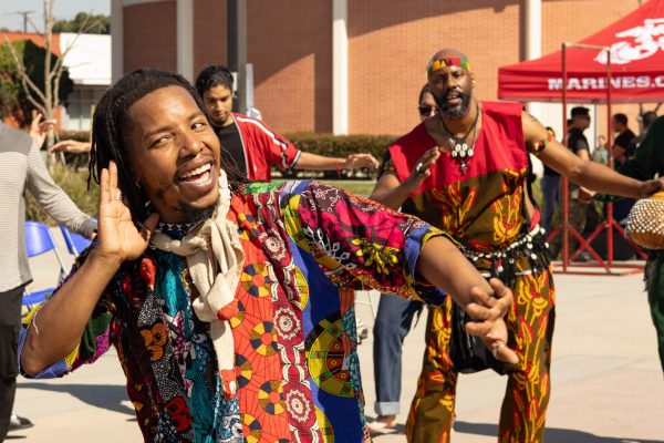 Duante Nabi Fyall performs in the middle of a dance circle in front of the Communications Building on Wednesday, Feb. 26. He is a professor of West African dance at the University of California, San Diego. (Katie Gronenthal | The Union)