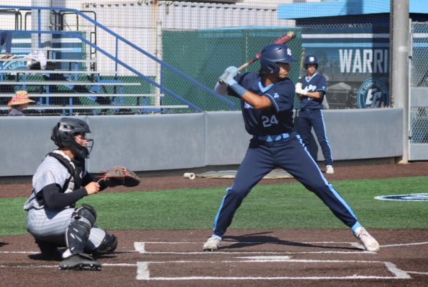 (L-R) Rio Hondo College Roadrunners catcher Izaak Fernandez, El Camino College Warriors first baseman Gil Solis and shortstop Slater Nuñez await the throw from Roadrunners pitcher Matthew Leyva on ECC Warrior Field Tuesday, March 4. With bases loaded, Solis is walked and brings home outfielder Ryan Matsukawa in the first inning. (Elsa Rosales | The Union)