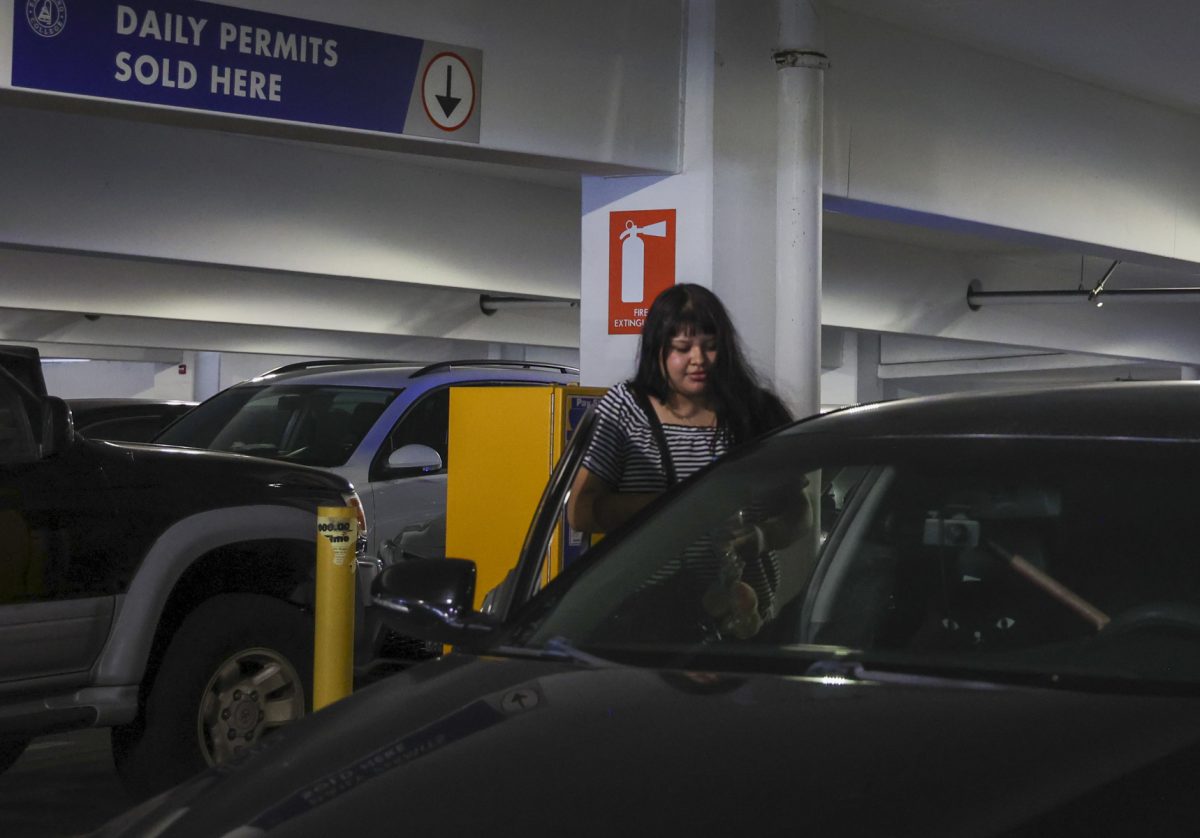 El Camino College radiologic technology major Virginia Argueta, 19, gets out of her car in Lot C on Monday, Sept. 8. (Erica Lee | The Union)