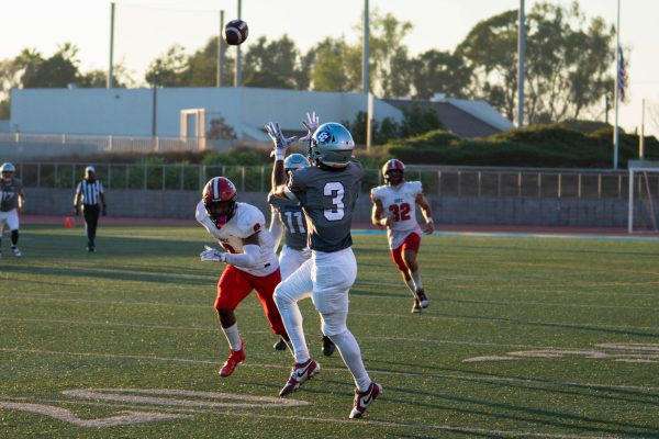 El Camino wide receiver Cameron Brewer makes the catch and takes it to the endzone for a 45 yard touchdown at Murdock Stadium on Aug. 30. Brewer and the Warriors’ offense had a fantastic game, scoring 68 points and 677 total offensive yards. (Ryan Hirabayashi | The Union)