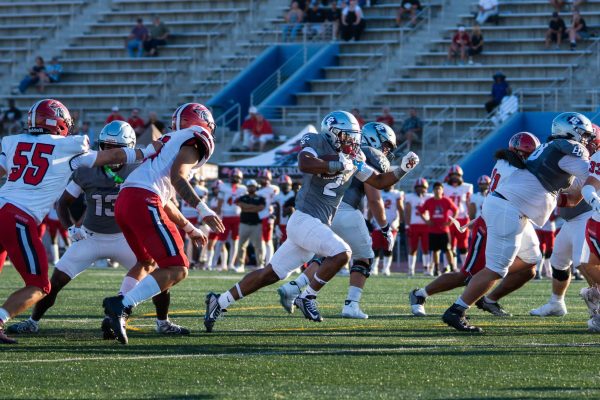 El Camino running back, Jaden Moore, goes for an eight yard rushing touchdown for the first score of the home opener at Murdock Stadium on Aug. 30. Moore and the Warriors went on to dominate Santa Barbara 68-6. (Ryan Hirabayashi | The Union)