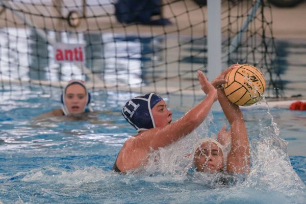 El Camino College Women's water polo attacker Olivia Mozian attempts to steal Los Angeles Valley College Monarchs players ball in game on Wednesday, Sep. 10, 2025 in the ECC aquatics center.  Warriors lose 19-10 in their season's opening game. (Oriana de Quay | The Union)