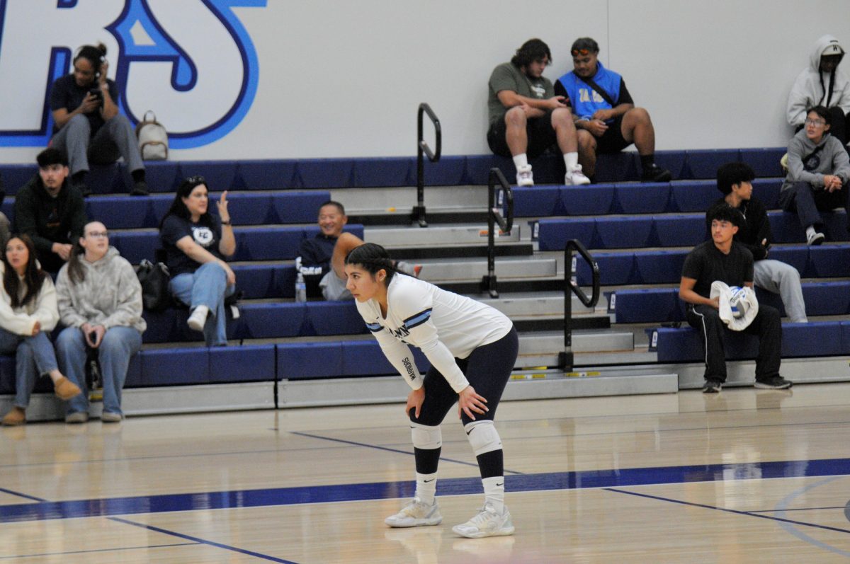 Cynthia Nario (2, LB) prepares to receive the opponent's service in the service reception zone. The libero's consistent digging and passing anchored the El Camino Warriors' 3-0 victory.
(Cardoso, Juan Carlos I The Union) Photo credit: Juan Carlos Cardoso