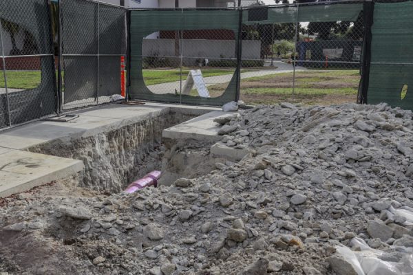 A ditch with exposed piping show signs of progression of construction near the Schauerman Library on Oct. 2. (Donovan Harris | The Union)