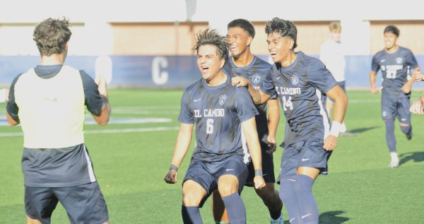 Alexander Salas (6) celebrates with teammates after scoring the Warriors' second goal against Mira Costa at El Camino College. Salas's spectacular free-kick temporarily gave the Warriors a 2-1 lead in the second half.