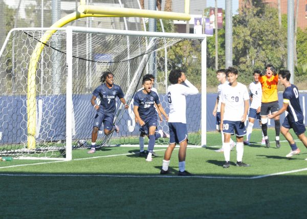 El Camino College's Juan Tibocha (20) celebrates with team after scoring the game-tying goal against Cerritos College on November 7. The goal ignited a comeback that ultimately secured a 2-1 victory for the Warriors. El Camino defeated Cerritos in the conference matchup at home in Torrance,.