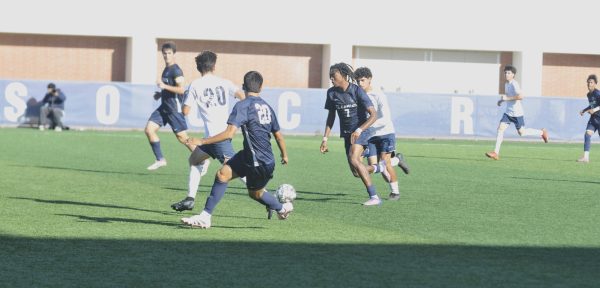 El Camino Worriors forward Julio Portillo (7) initiates an attack against heavy Cerritos College defense a conference soccer match. Portillo's solid performance helped the Warriors secure a pivotal 2-1 comeback victory. The game was played on November 7 at El Camino College in Torrance, California.