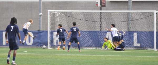 Mira Costa's Lincoln Newcomer (7) scores the first goal of the game against the Warriors at El Camino College on Saturday, Nov. 22. Newcomer's early strike gave Mira Costa a quick lead. The Warriors ultimately suffered a tough 3-2 defeat in the match