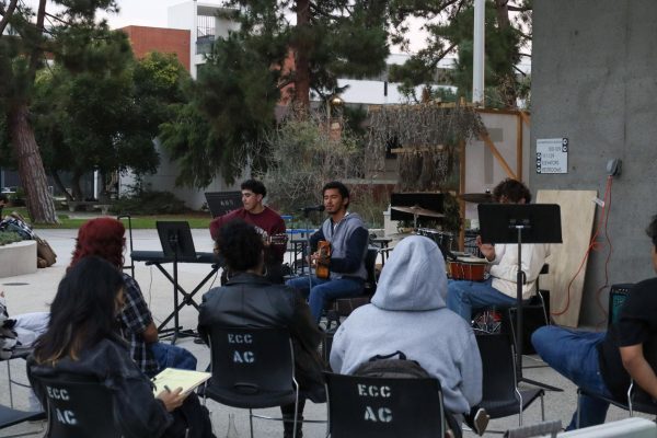 A small audience watches and listens to bands perform at the Battle of the Bands event at the Arts Building on Nov. 12. (Donovan Harris | The Union)