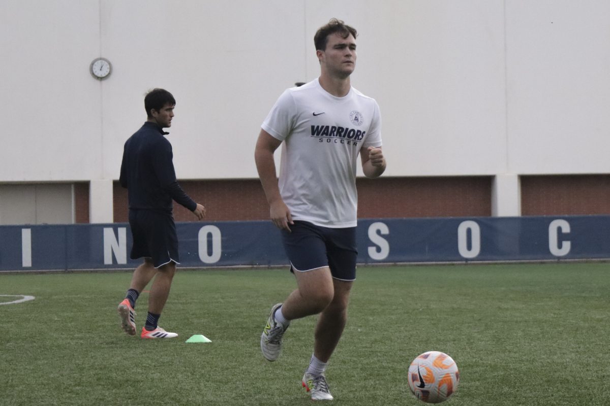 Warriors men's soccer forward Owen Hancock dribbles to the end of the field during a passing drill on Oct. 13 at the PE & Athletics Field. Owen gets inspiration for his form of play from retired Dutch player Robin Van Persie, who is now head coach for Eredivisie team Feyenoord. (Philip Kozel-Lopez | The Union) Photo credit: Philip Kozel-Lopez