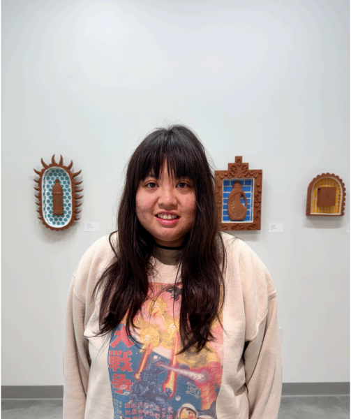 Student Alyssa Nagahiro visits artist and ceramicist Yvette Trujillo's pieces in the El Camino College Art Gallery and Anthropology Museum. She said her favorite piece was the El Grito de los Chapulines, displayed in the museum. (Oriana de Quay | The Union)