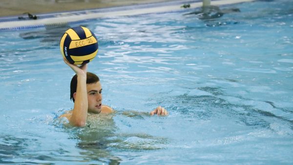 ECC Waterpolo Warrior, Cooper Josic, 19, practices passes with teammates during practice on Thursday, Oct. 23 at the Aquatics Center. (Savannah Anderson | The Union)