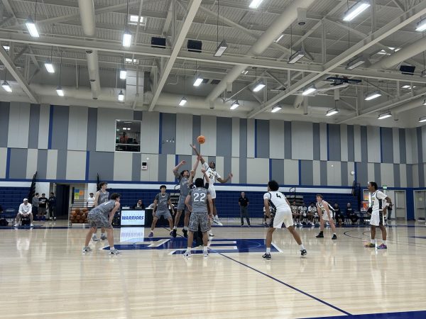 The Warriors and Vikings battle for possession at the tip-off to open Thursday's game at El Camino.