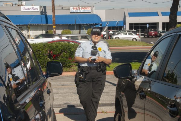 Cadet Hurtado, new to the El Camino College Police team is imputing the vehicles information and requesting a search for the cars ECC registration through her device. Two vehicles were issued a parking citation for illegal parking in Lot B on December 2, 2025. (Isaac Ramirez|The Union)