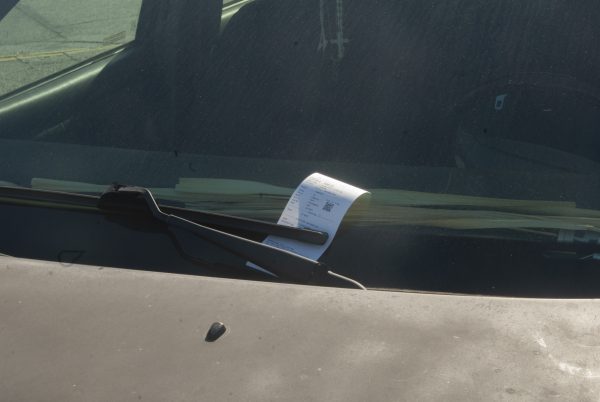 A parking citation sits on the dashboard of an unsuspecting El Camino College student. The citation was issued on December 2, 2025 due to the vehicles being illegally parked in a no parking zone. (Isaac Ramirez|The Union)