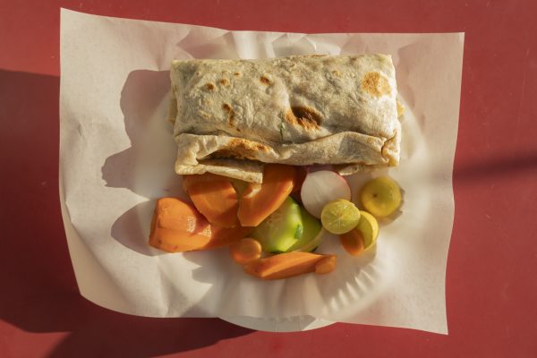 Al Pastor Burrito from Ricos Tacos El Tio Inc. in Gardena, priced at $12.79, served with a side of housemade pickled carrots, cucumber, lemon and radish. Customers can make it a Combo Meal #1 by adding a drink. (Oriana de Quay | Warrior Life)