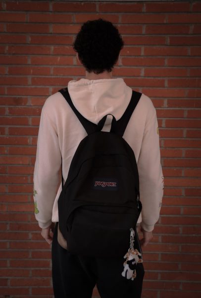 Stephen Treutlein, 20, mechanical engineering major, wears his black Jansport backpack to class. (Kaitlyn Gochez)