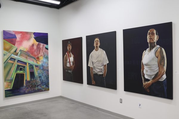 On the left, Keiva Campbell’s “A Tribute to April Savino,” honoring the half sister Kevia never met, is displayed alongside Fabian Debora’s portrait series “Love Letter” a Reclaiming Humanity at the El Camino College art gallery Thursday, Feb. 26, 2026. (Chelsea Alverez | The Union)