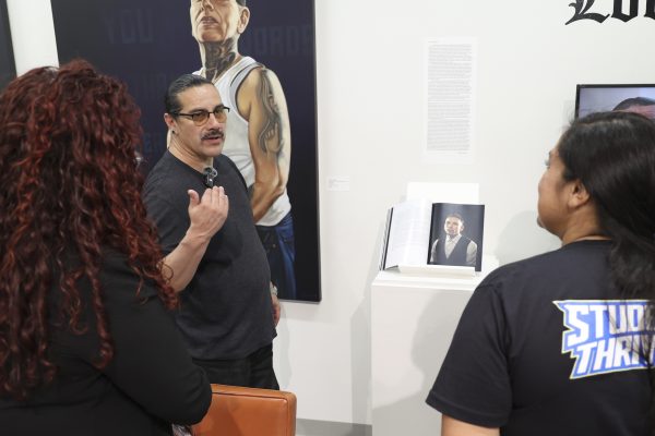 Fabian Debora expresses his experiences, emotions and thoughts through his “Love Letter” series, which aims to reclaim humanity by addressing how people are demonized based solely on their appearance, at the El Camino College art gallery Thursday, Feb. 26, 2026.