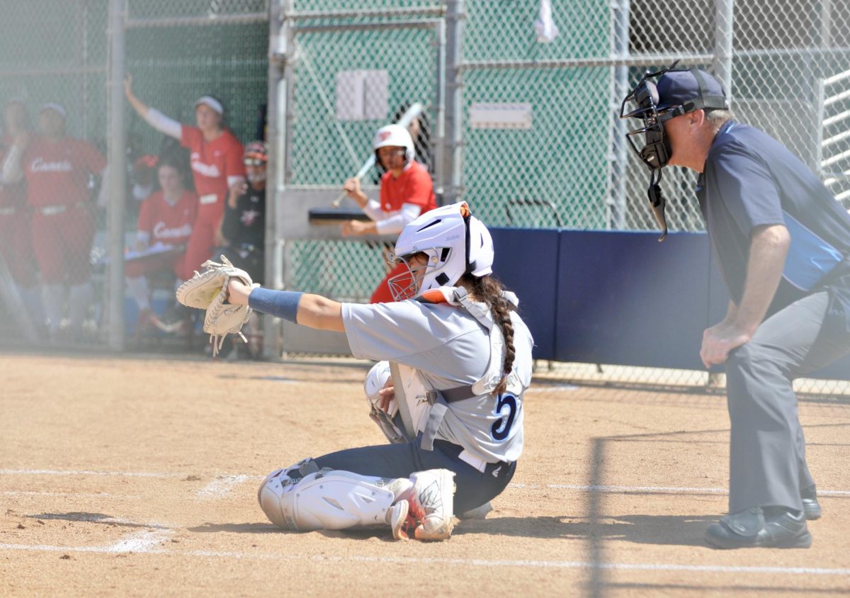 El Camino Warriors catcher and outfielder, Bryanna Morales, catches pitch from from ECC pitcher, Mahlia Espino on March 25, 2026. ( Riley Abrams | The Union )