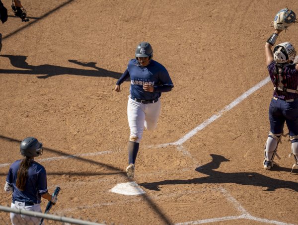 El Camino College right-handed batter Melissa Terrazas scores on a throwing error by Orange Coast's first baseman during the bottom of the second inning on Wednesday, March 18. (Gael Gallardo | The Union)
