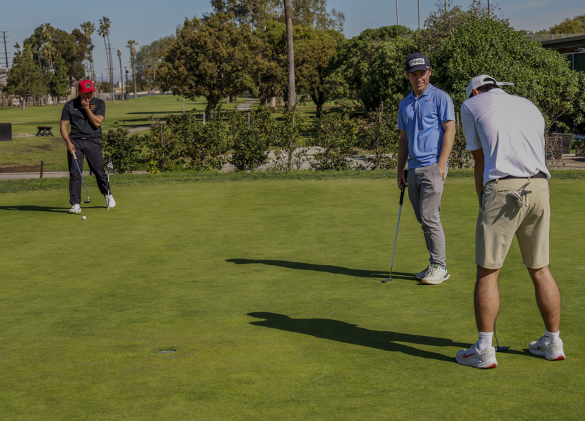 (L-R) Jack Martin, Ryan Fell, and Charlie Martin of the El Camino Golf Club talk while putting at the Alondra Park Golf Course on March. 6. (Donovan Harris | The Union) Photo credit: Donovan Harris