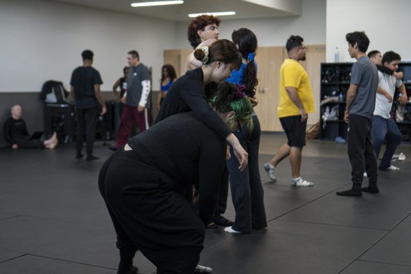 (L-R) Danielle Pasek, a kinesiology major, and Quyen Le, a radiologic technology major, work on back attack defense in their self-defense class at El Camino College on Wednesday, March 4.