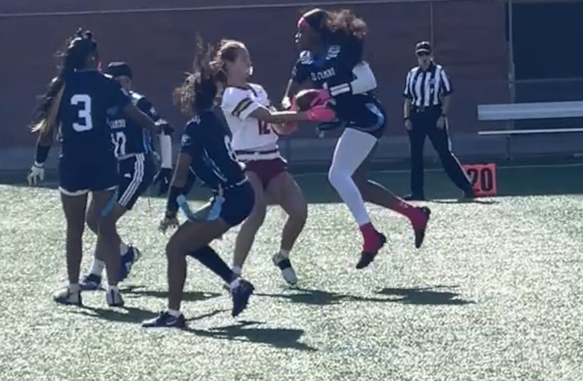 Destiny Okoli, freshman wide receiver for the El Camino Warriors, snatches the ball against  Saddleback College during the Warriors women’s flag football game on March 10. c